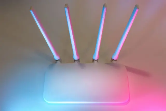 WiFi router with antennas on a surface in a home